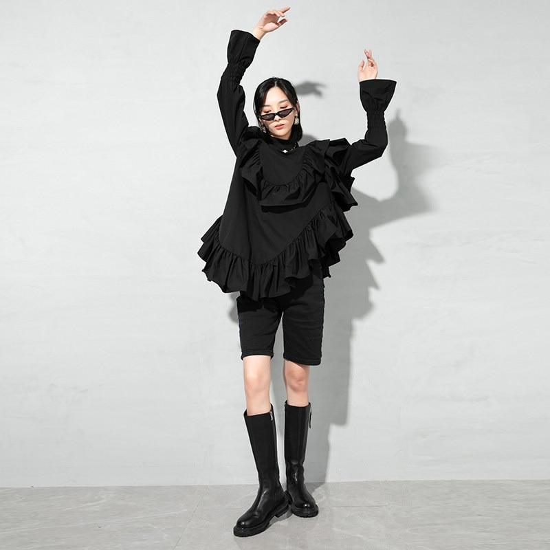 Marigold Shadows Blouses & Shirts Okimi Asymmetrical Ruffle Long Sleeve Shirt - Black